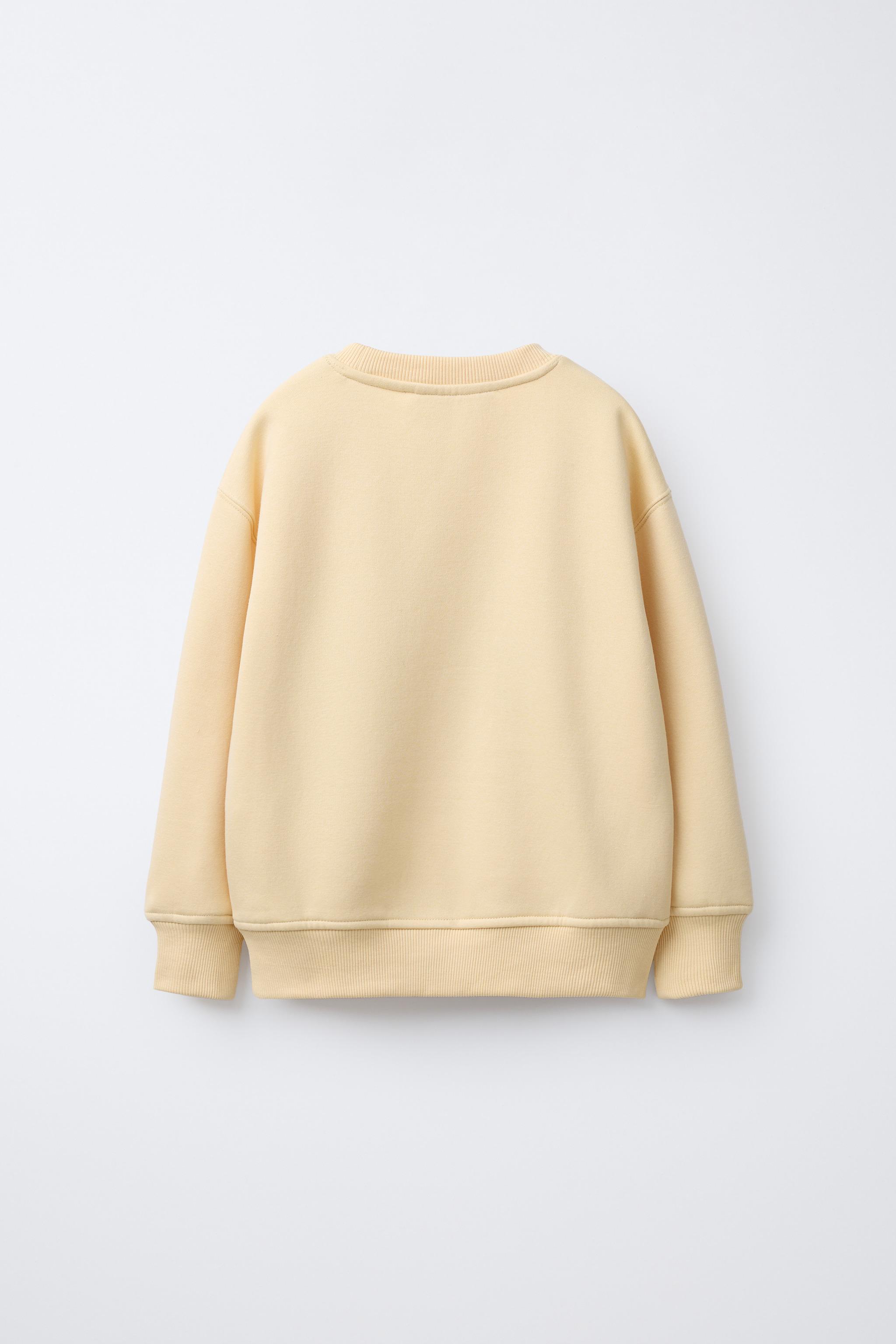 SWEAT AVEC PIÈCE EN VELOURS BOUCLÉ